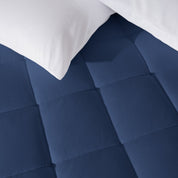 Close up of a cotton top mattress pad with pillows from above.