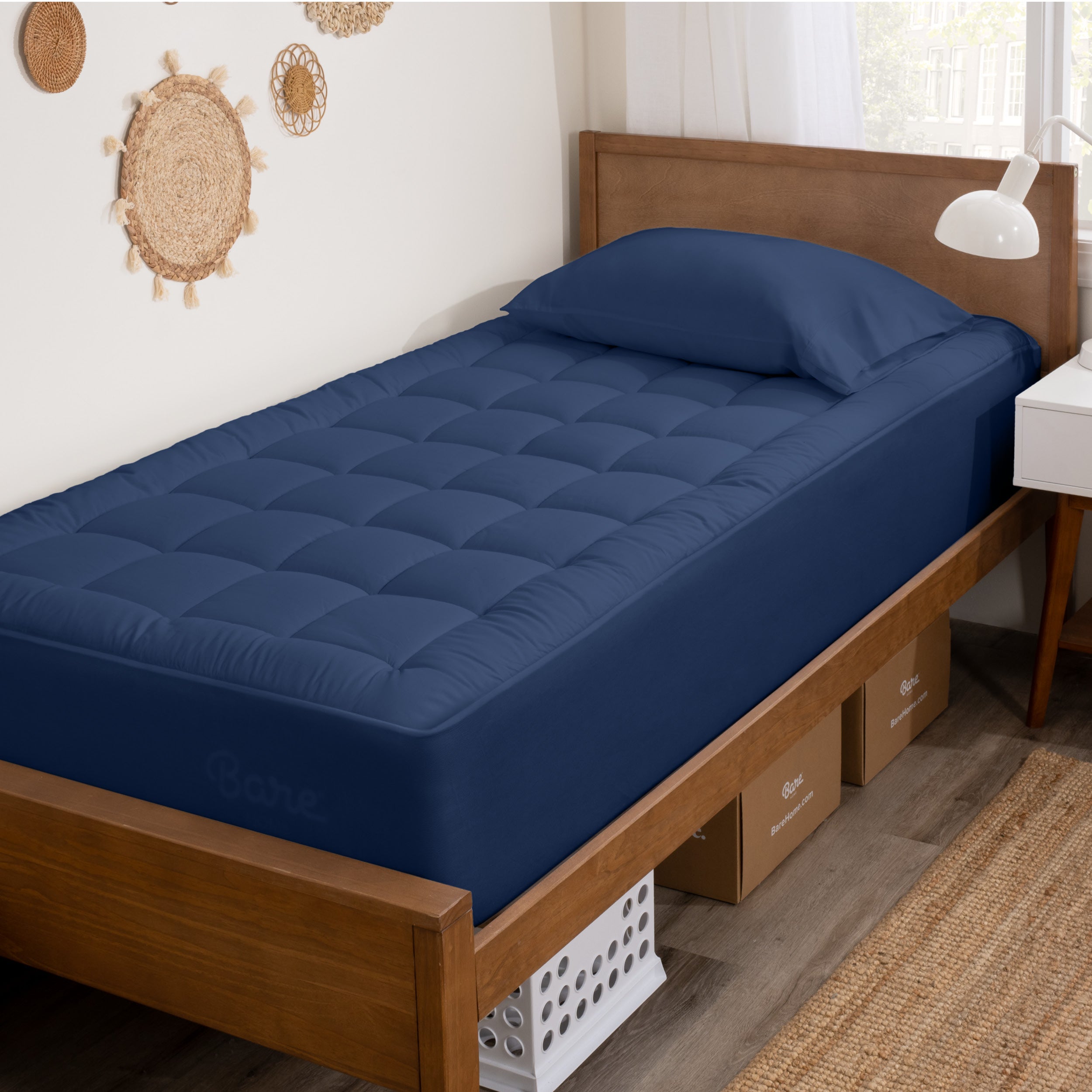 A mattress pad on a bed.