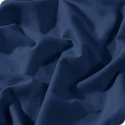 A close view of a button and lining on the flannel duvet cover.