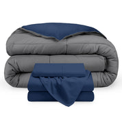 A reversible microfiber comforter and a coordinating sheet set folded and stacked 