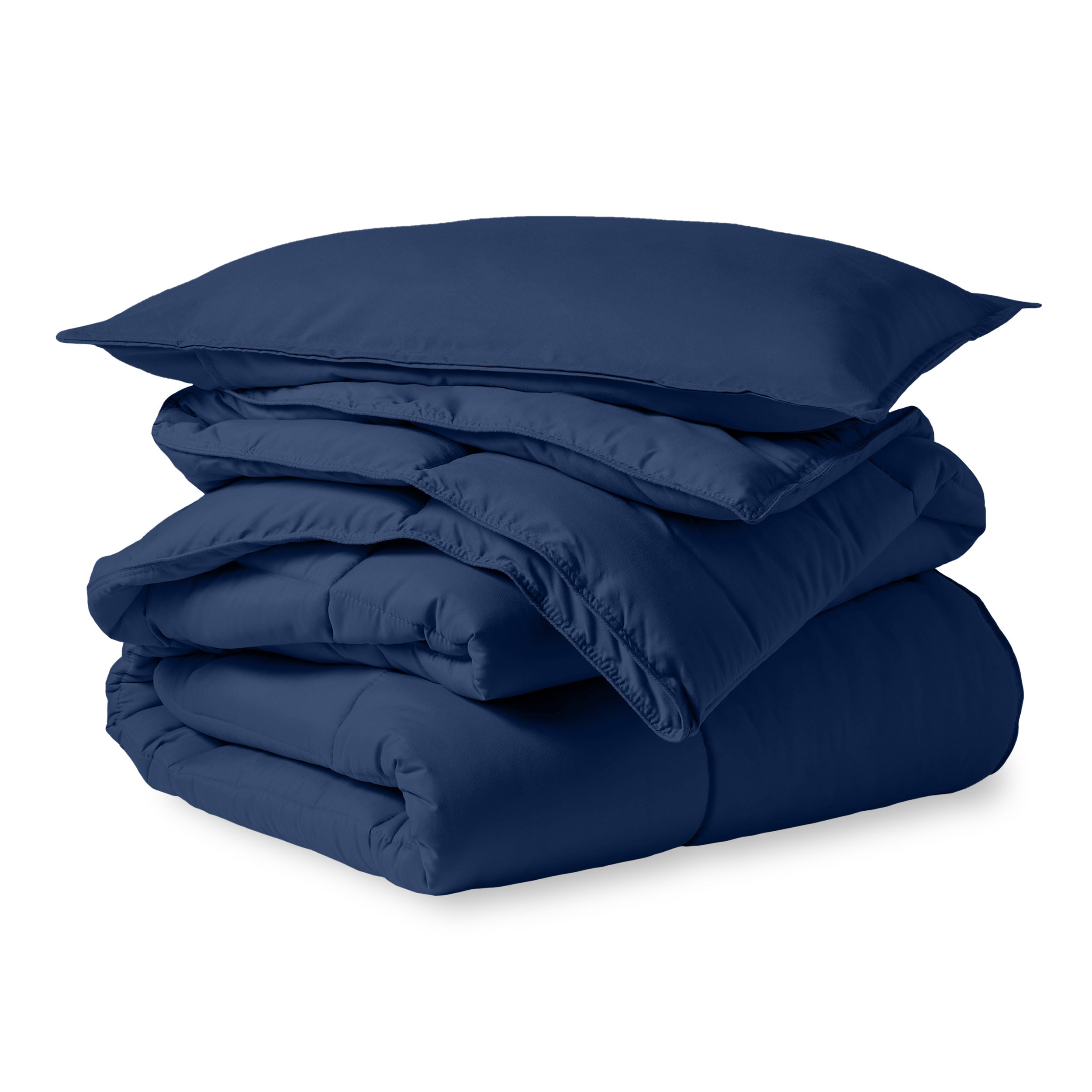 A microfiber comforter folded neatly with a pillow from above