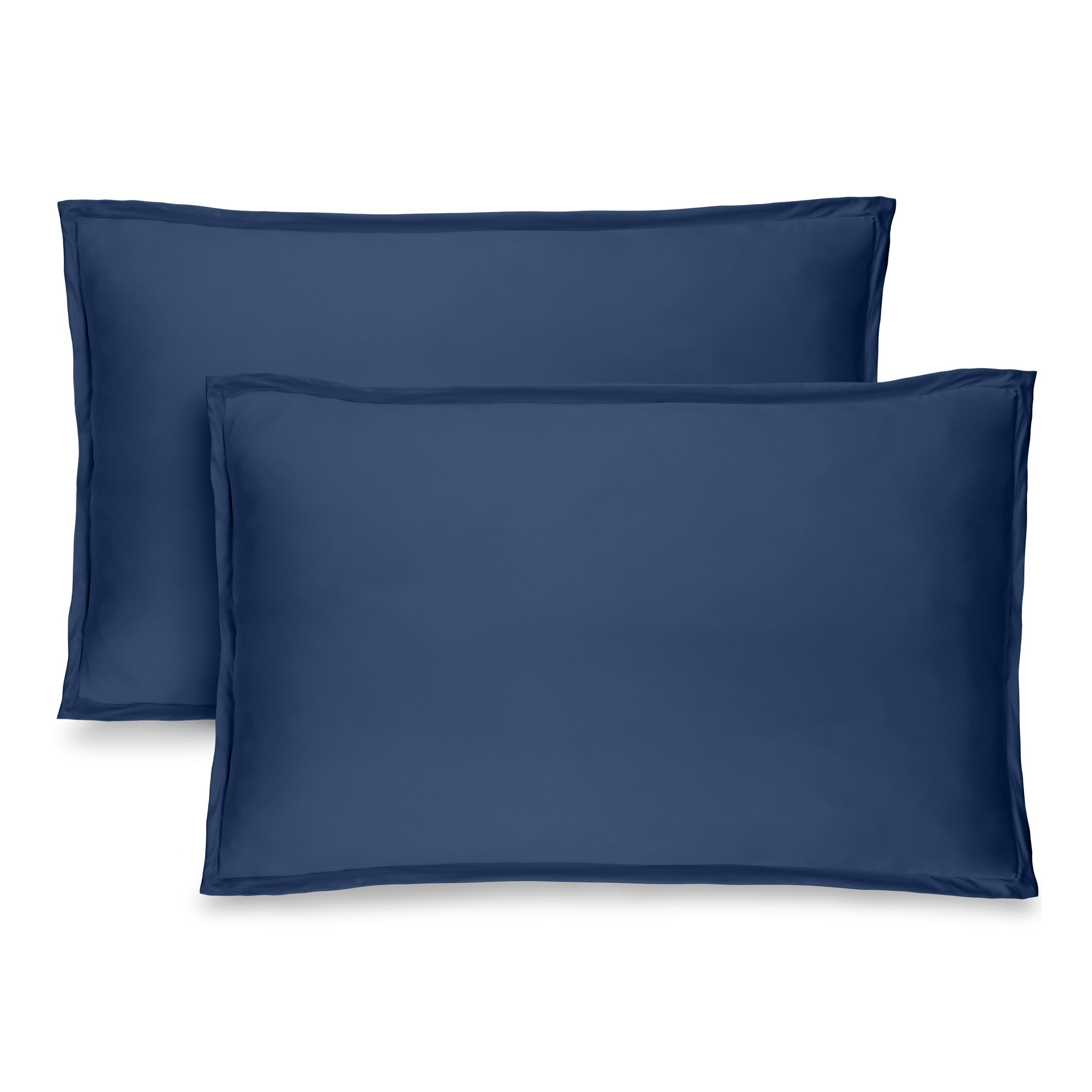 Two pillow shams on pillows standing up with one behind the other
