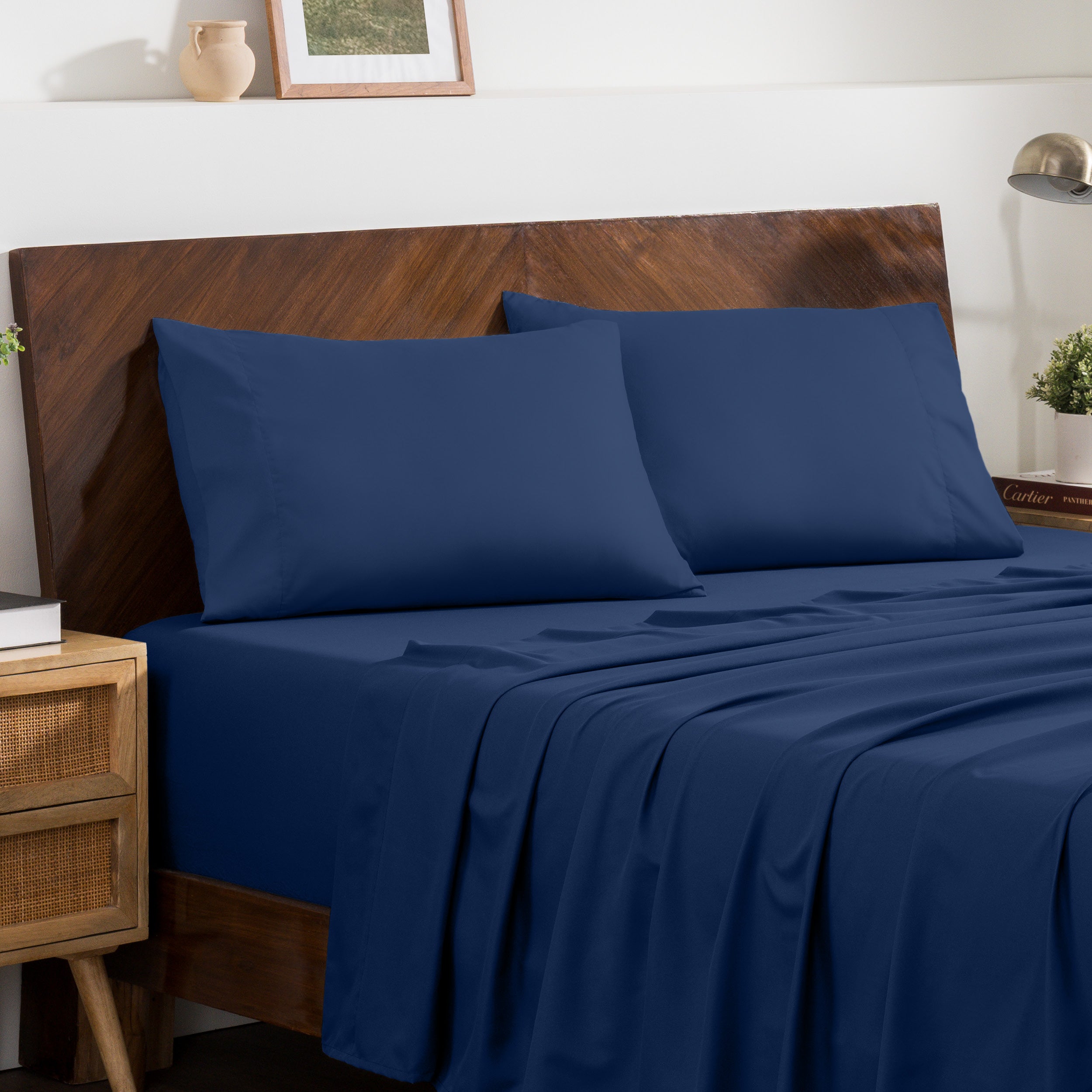 2 pillowcases on pillows on a nicely made bed