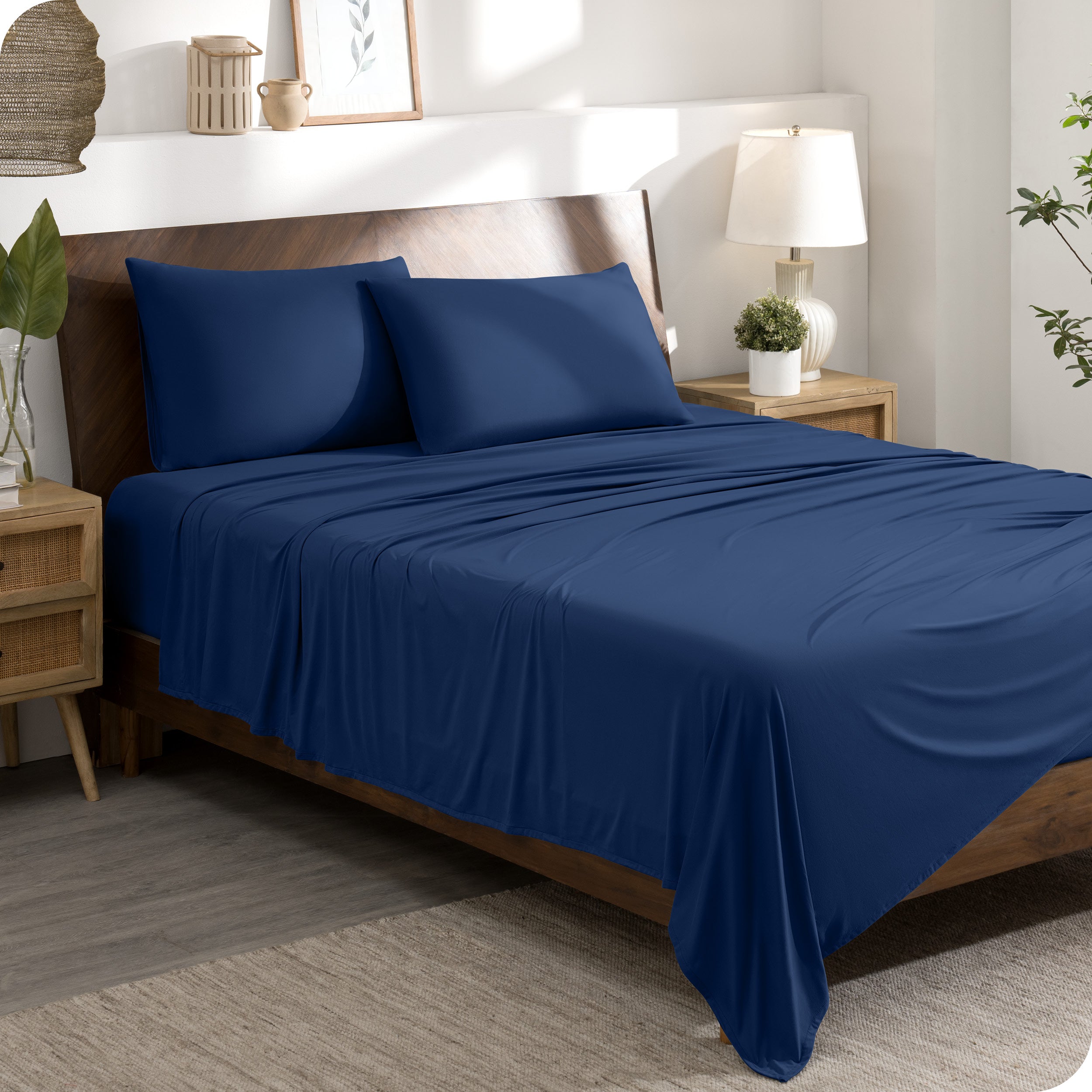 A stretch knit microfiber sheet set on a bed