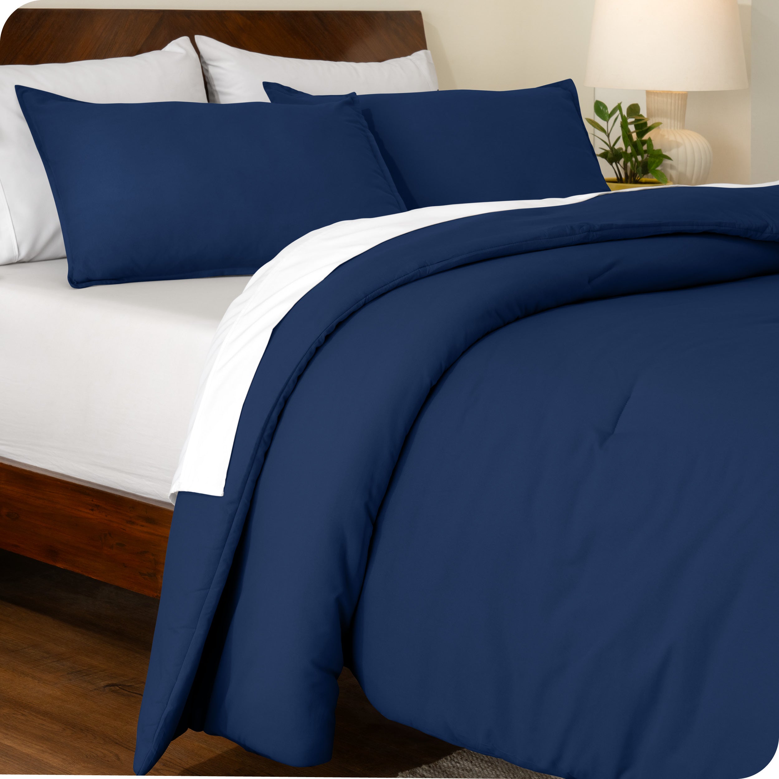A side view of a bed made with a track stitch comforter set