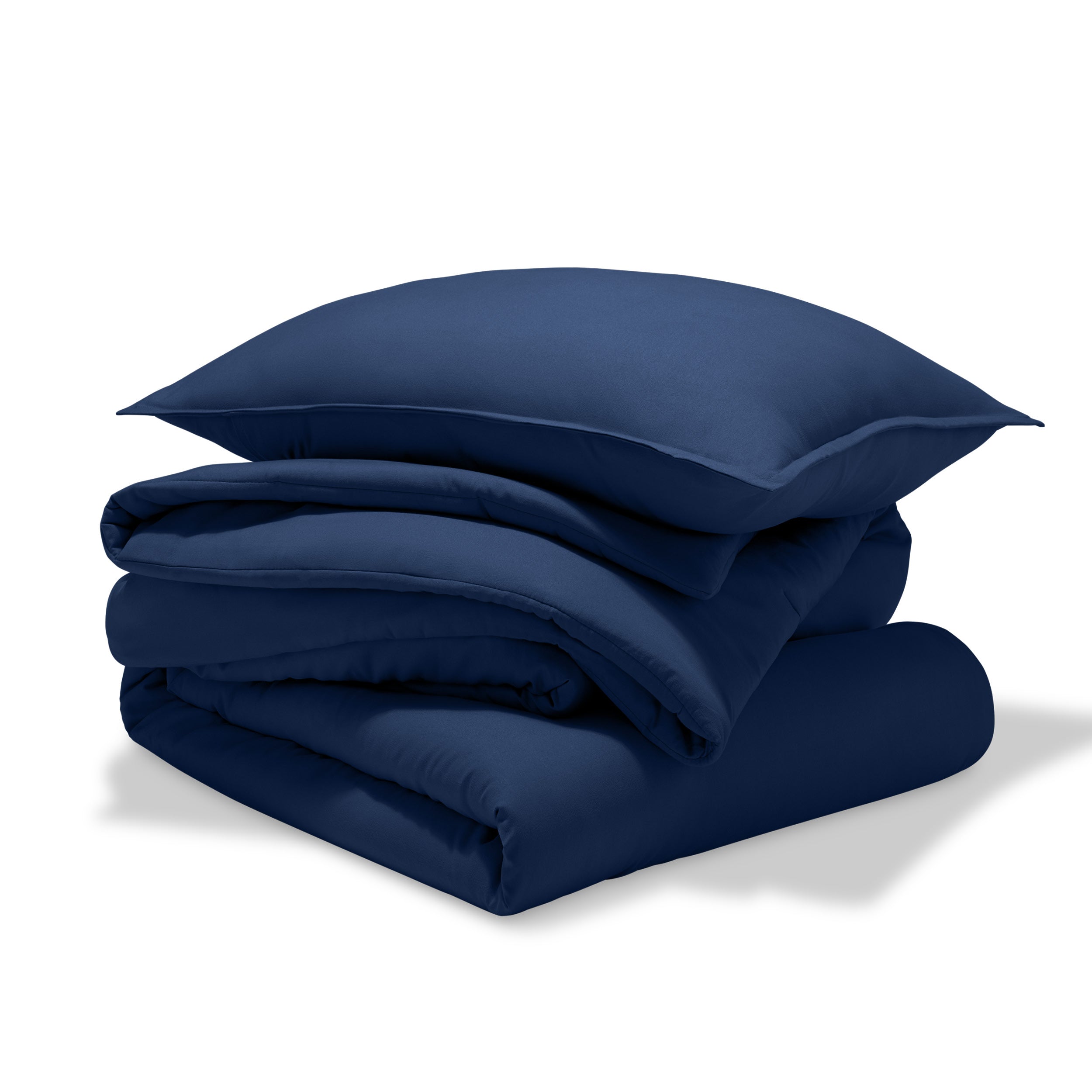 A comforter folded with a matching pillow sham stacked on top