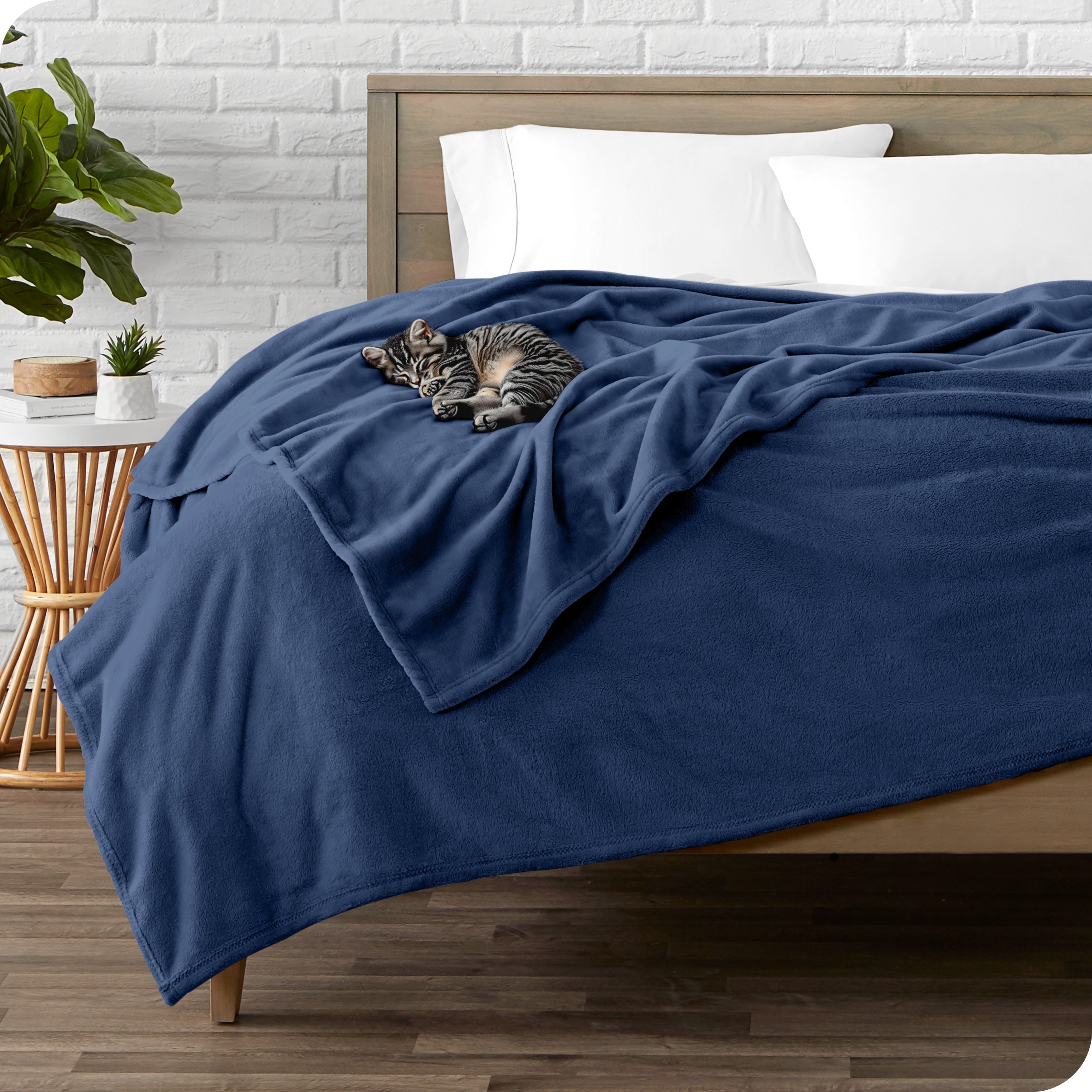 Microplush blanket laid out over a bed and folded back over itself