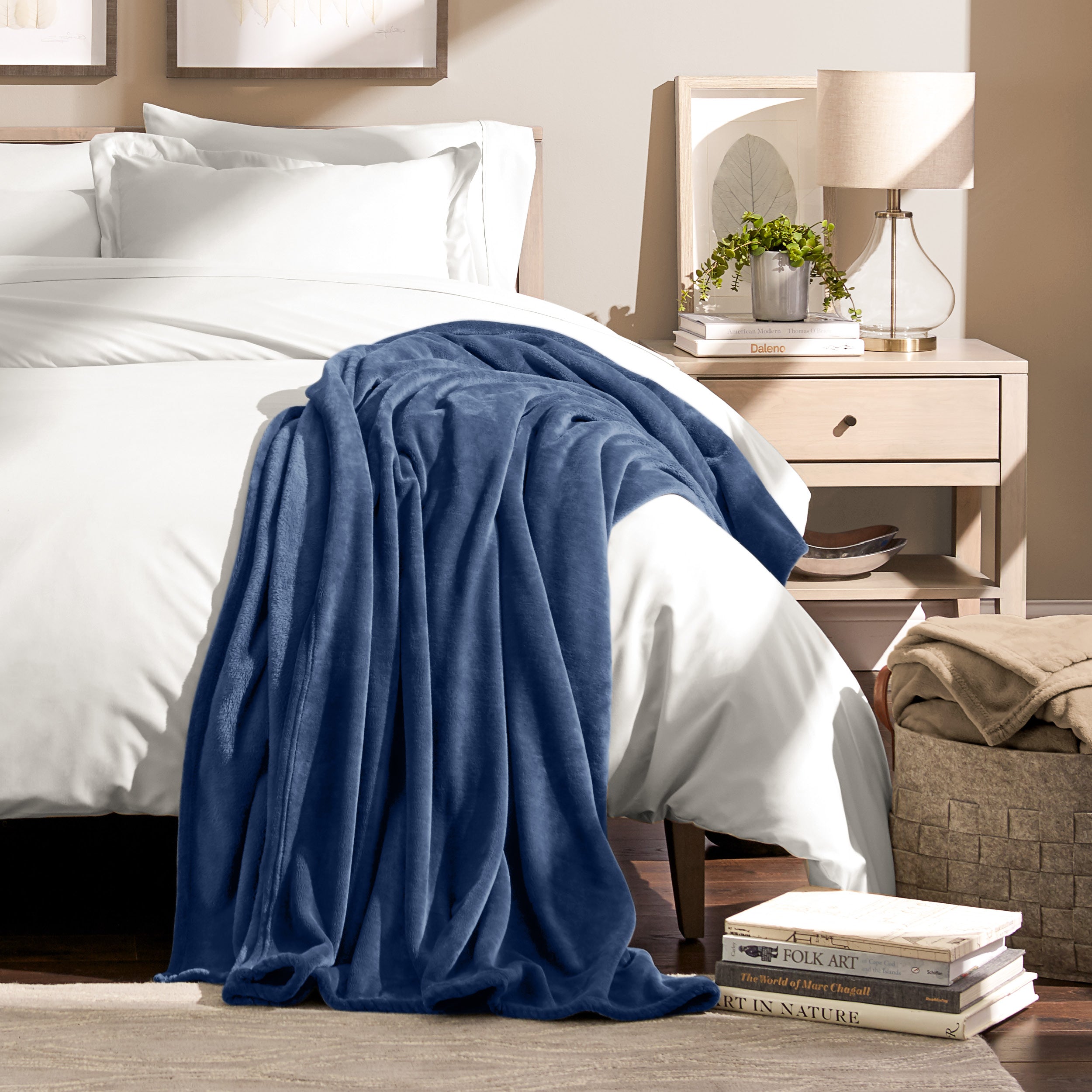 Microplush blanket laid out over a bed and folded back over itself