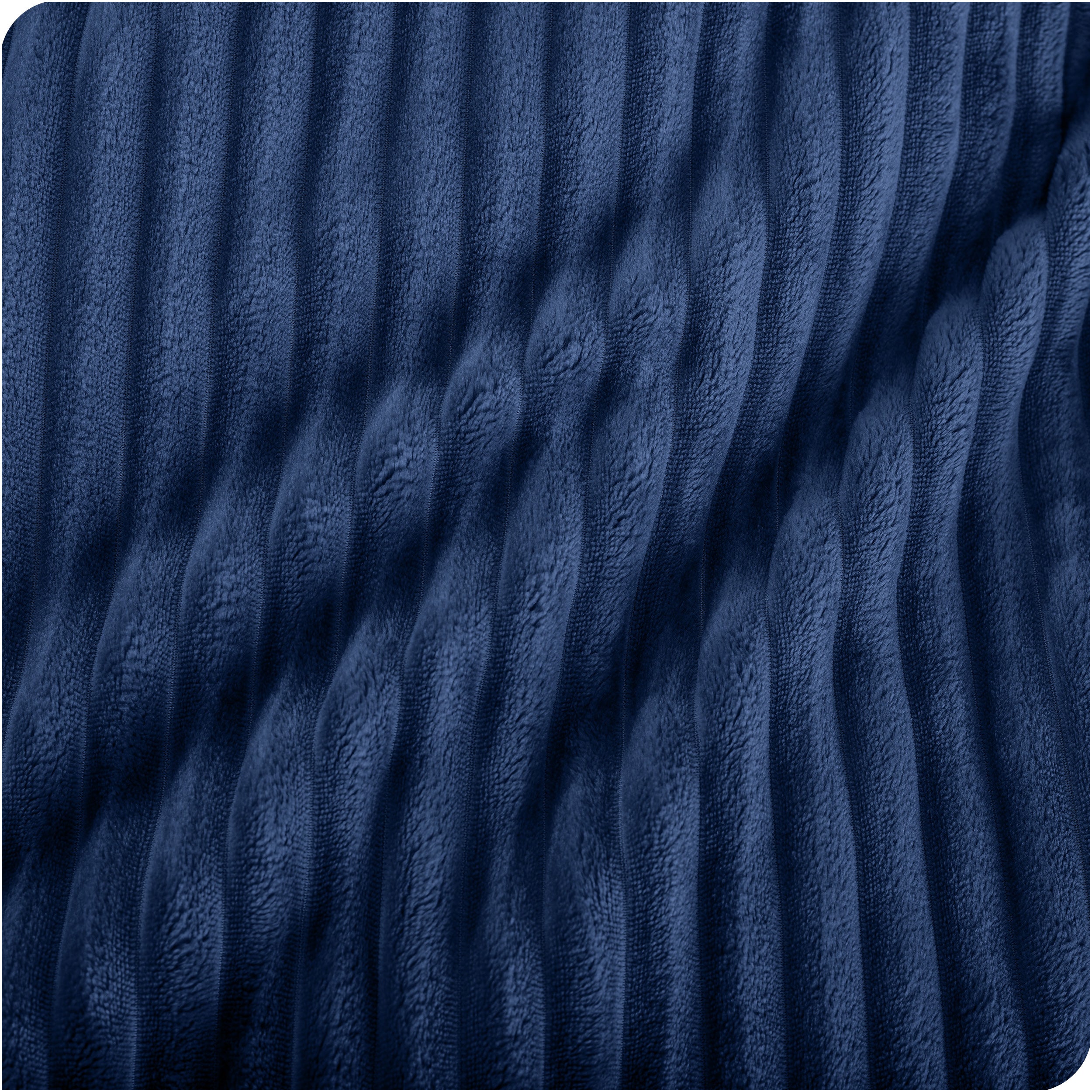 Close up of a ribbed microplush blanket showing the texture