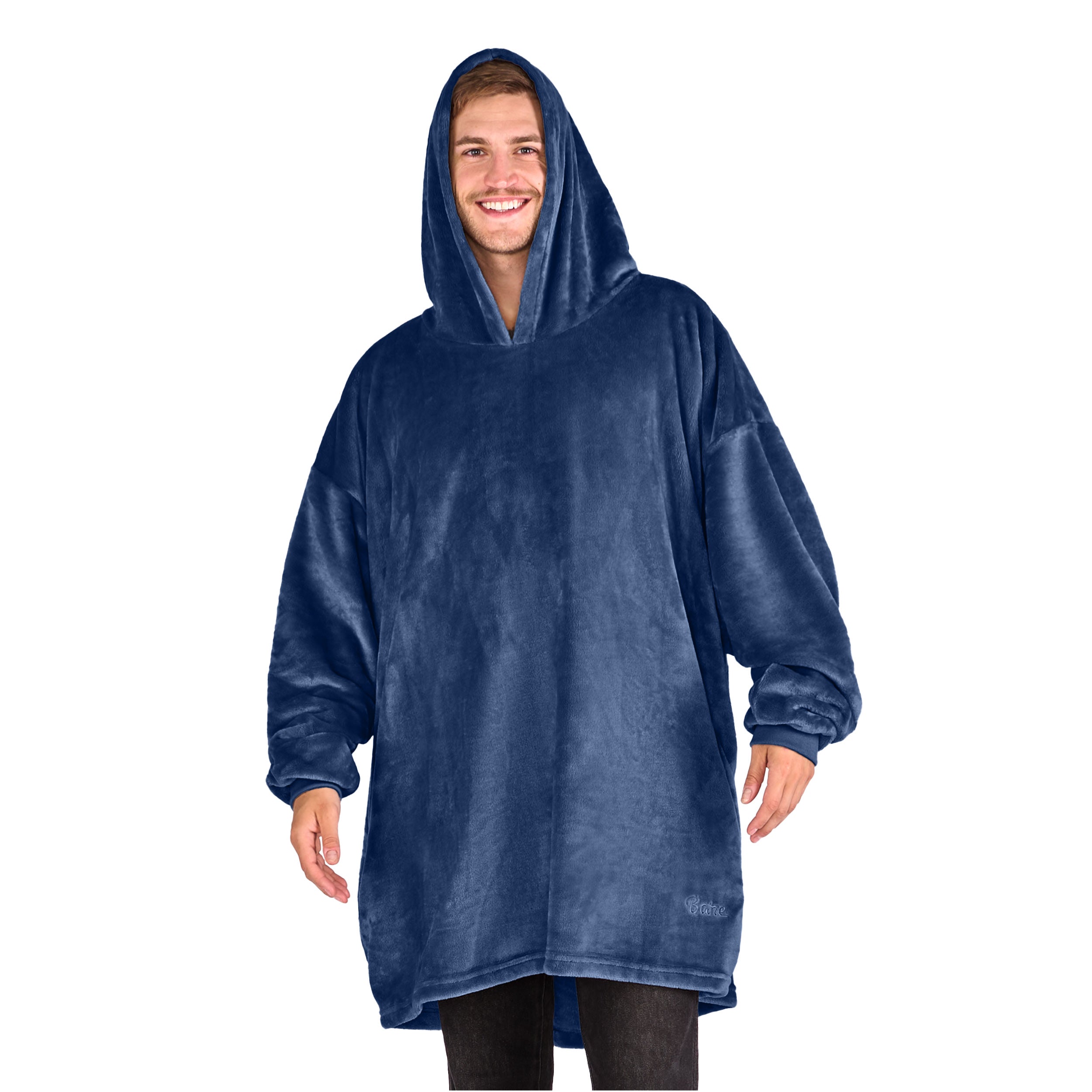 A man standing with a wearable blanket on
