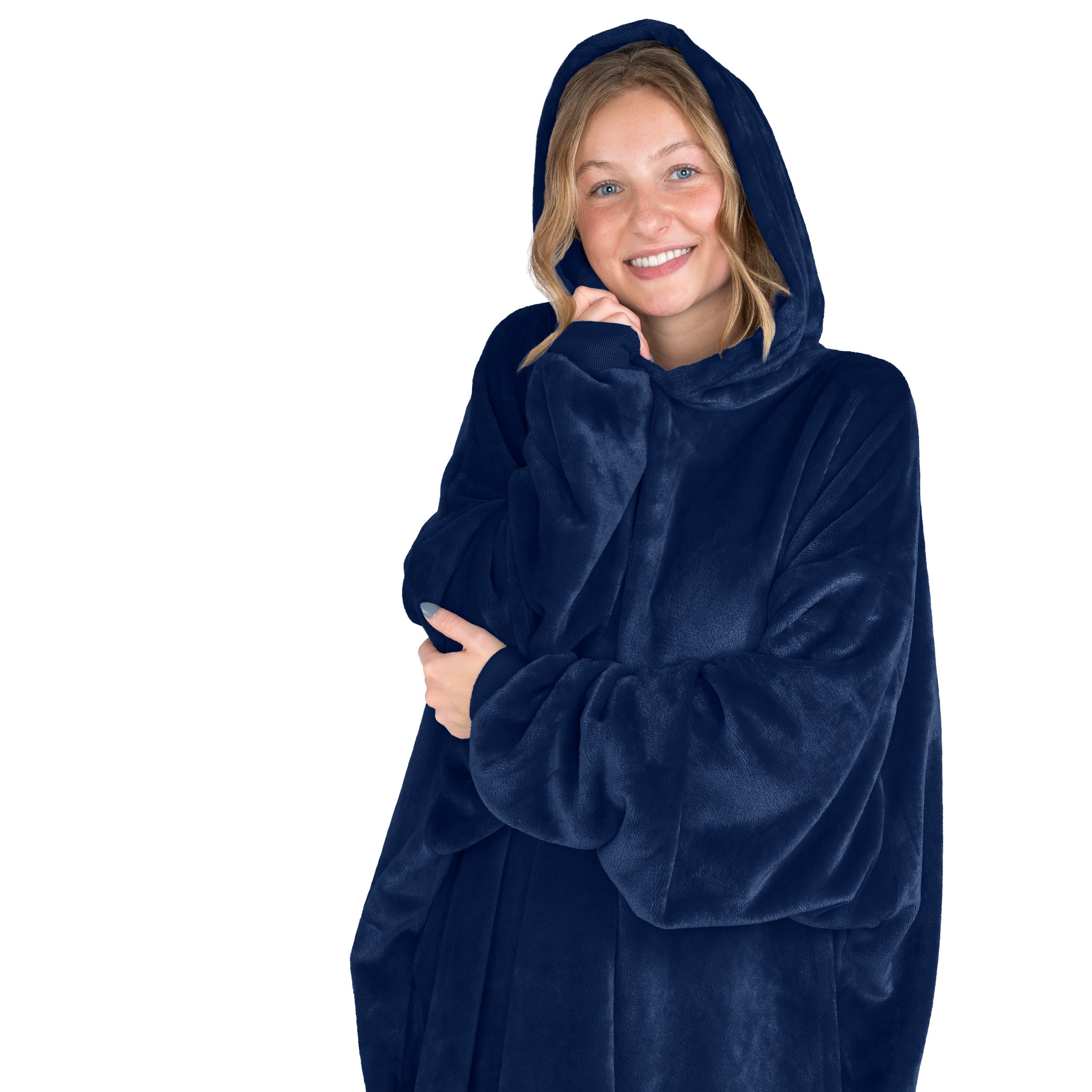 A smiling woman has a hooded wearable blanket on