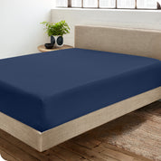A sateen fitted sheet on a bed