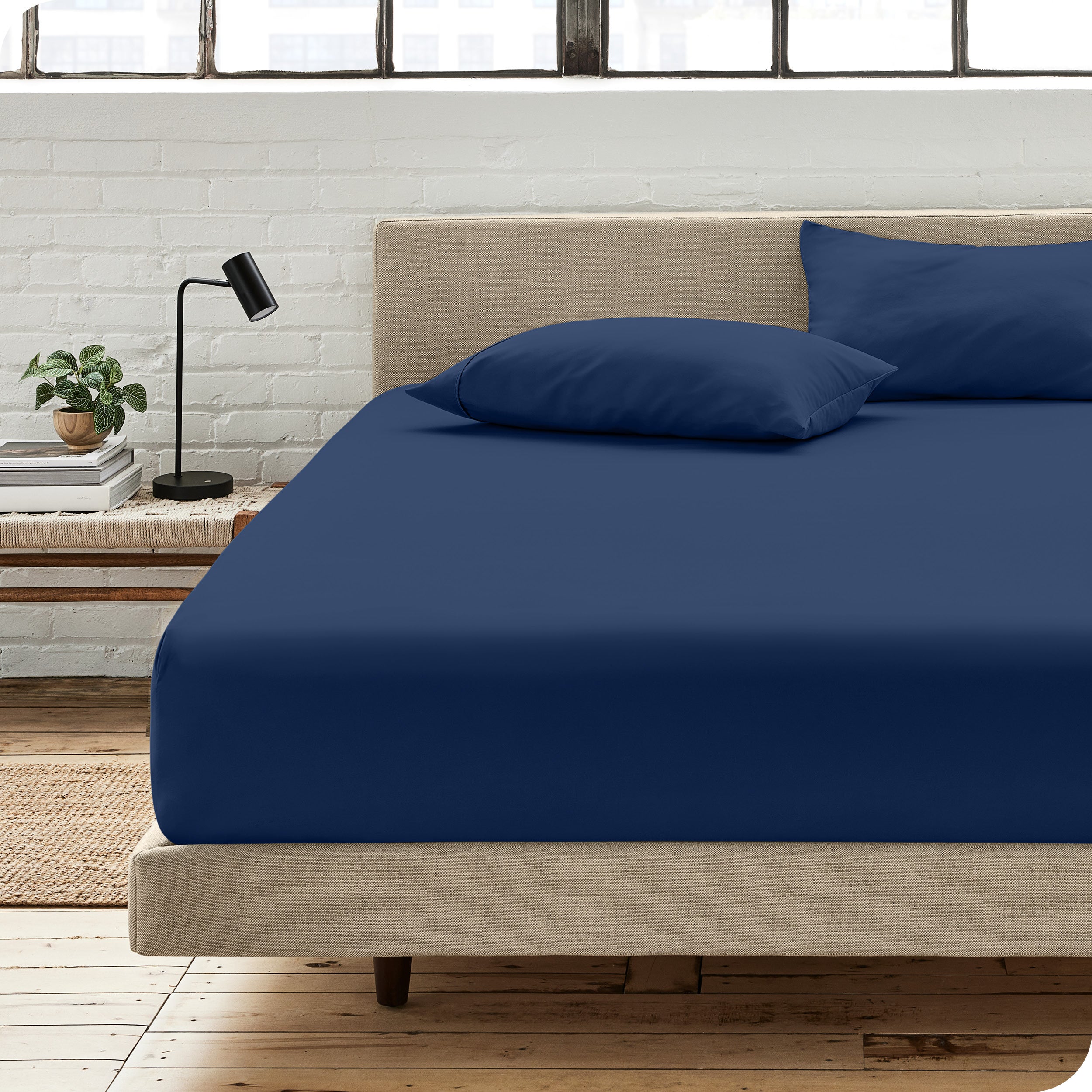 An organic cotton fitted sheet on a mattress