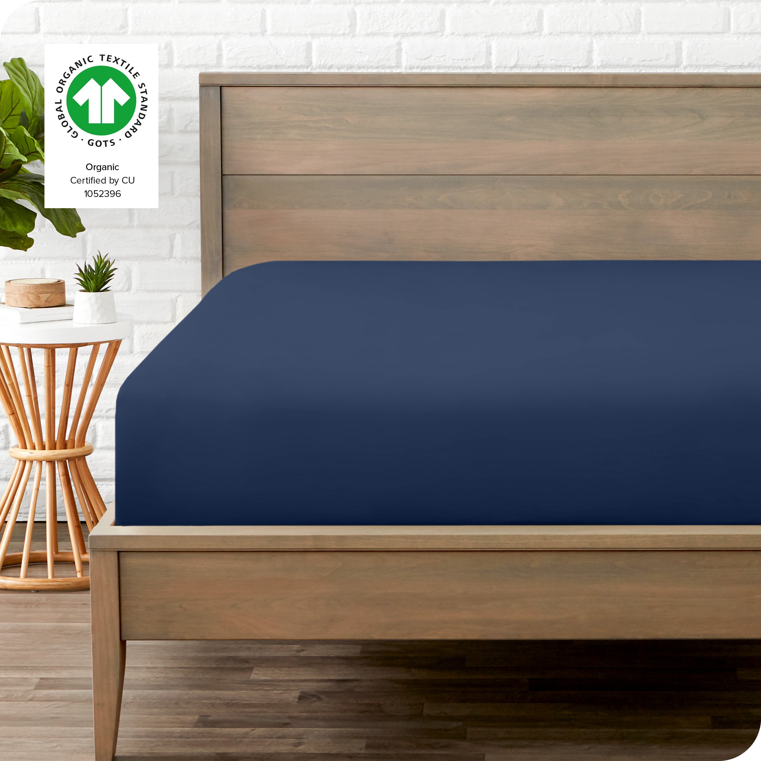 An organic percale bottom sheet on a mattress