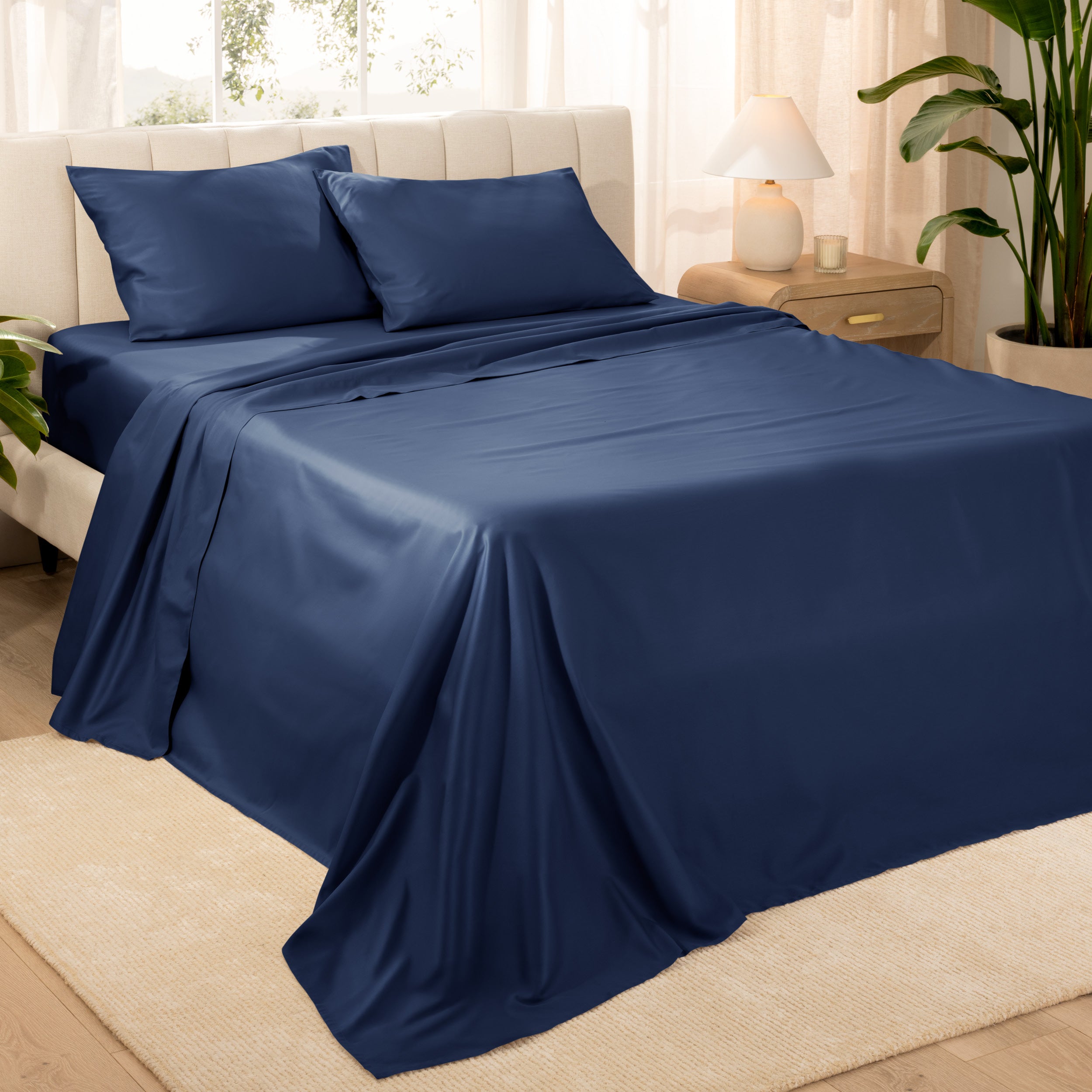 Diagonal view of a decorated room scene with sateen sheets