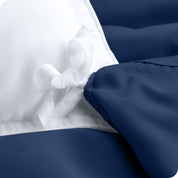 The corner ties of a duvet cover attached to a duvet insert