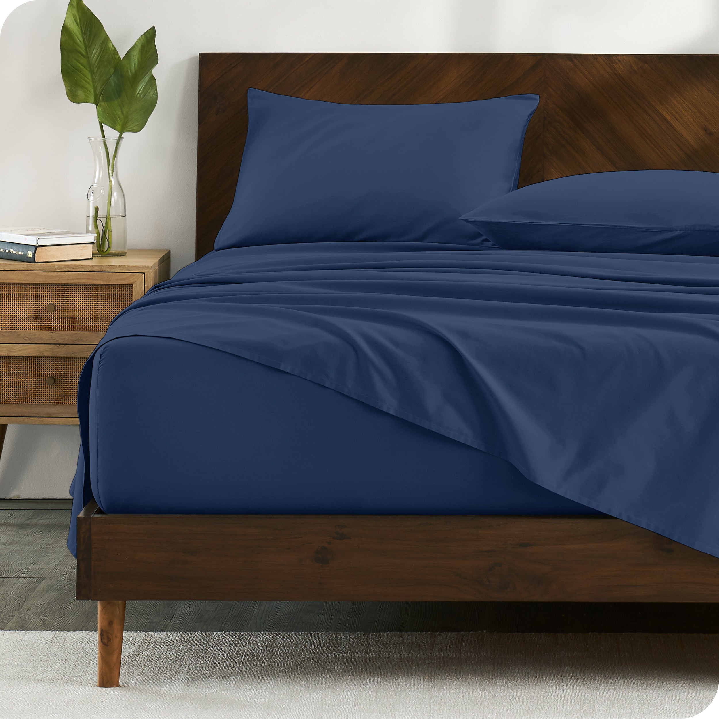 Percale sheets on bed in a modern bedroom