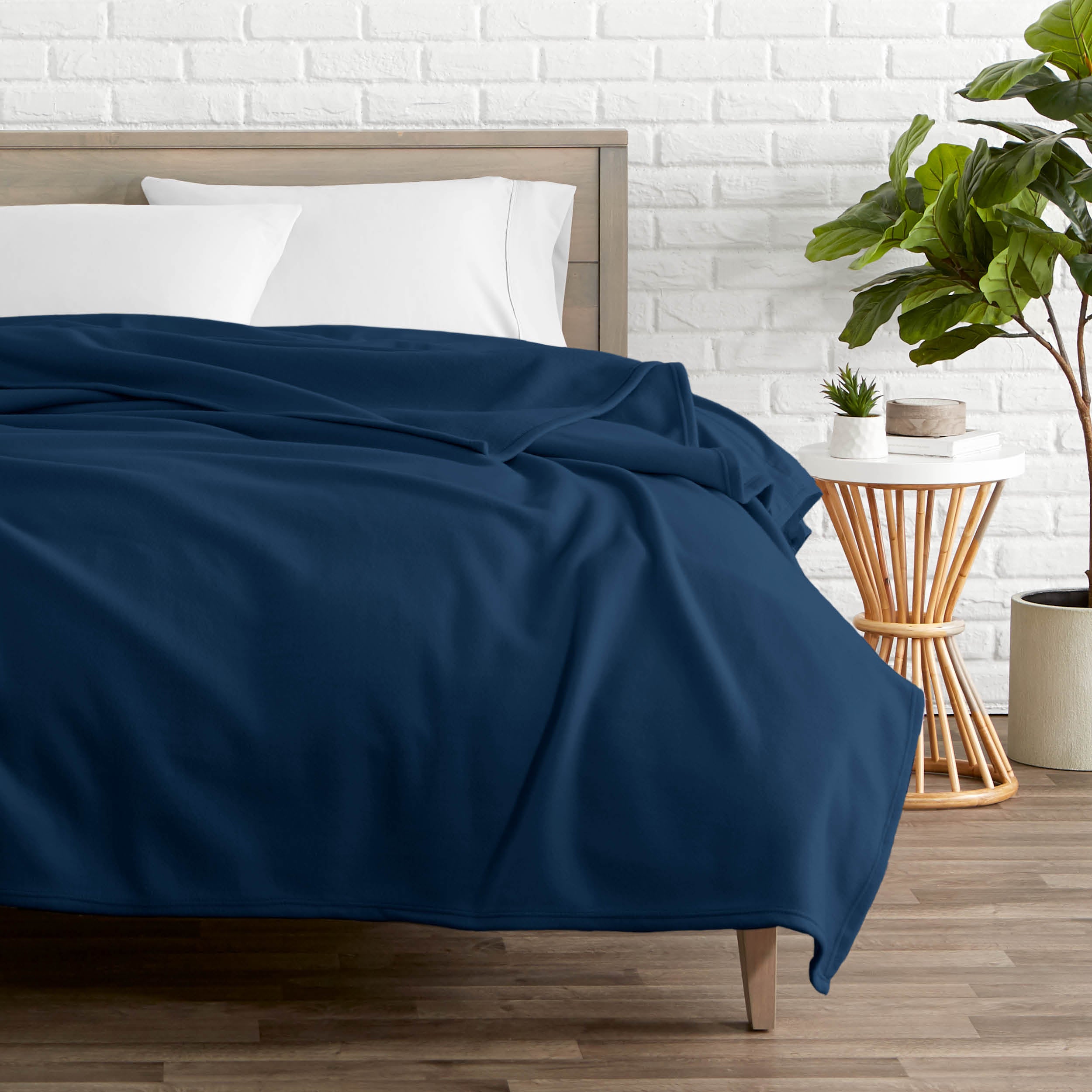 A polar fleece blanket on a bed