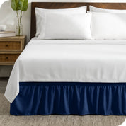 A wrap around bed skirt on a bed