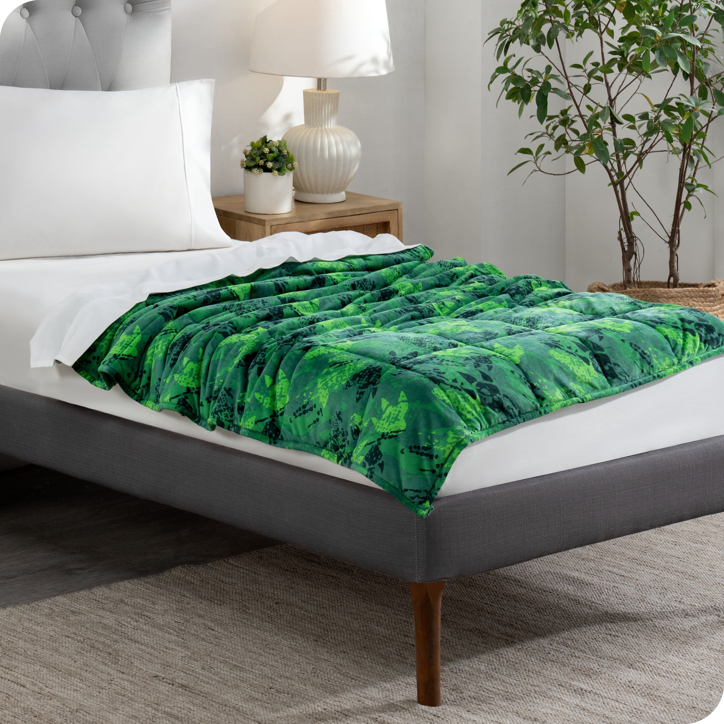 A weighted blanket laid out on a bed