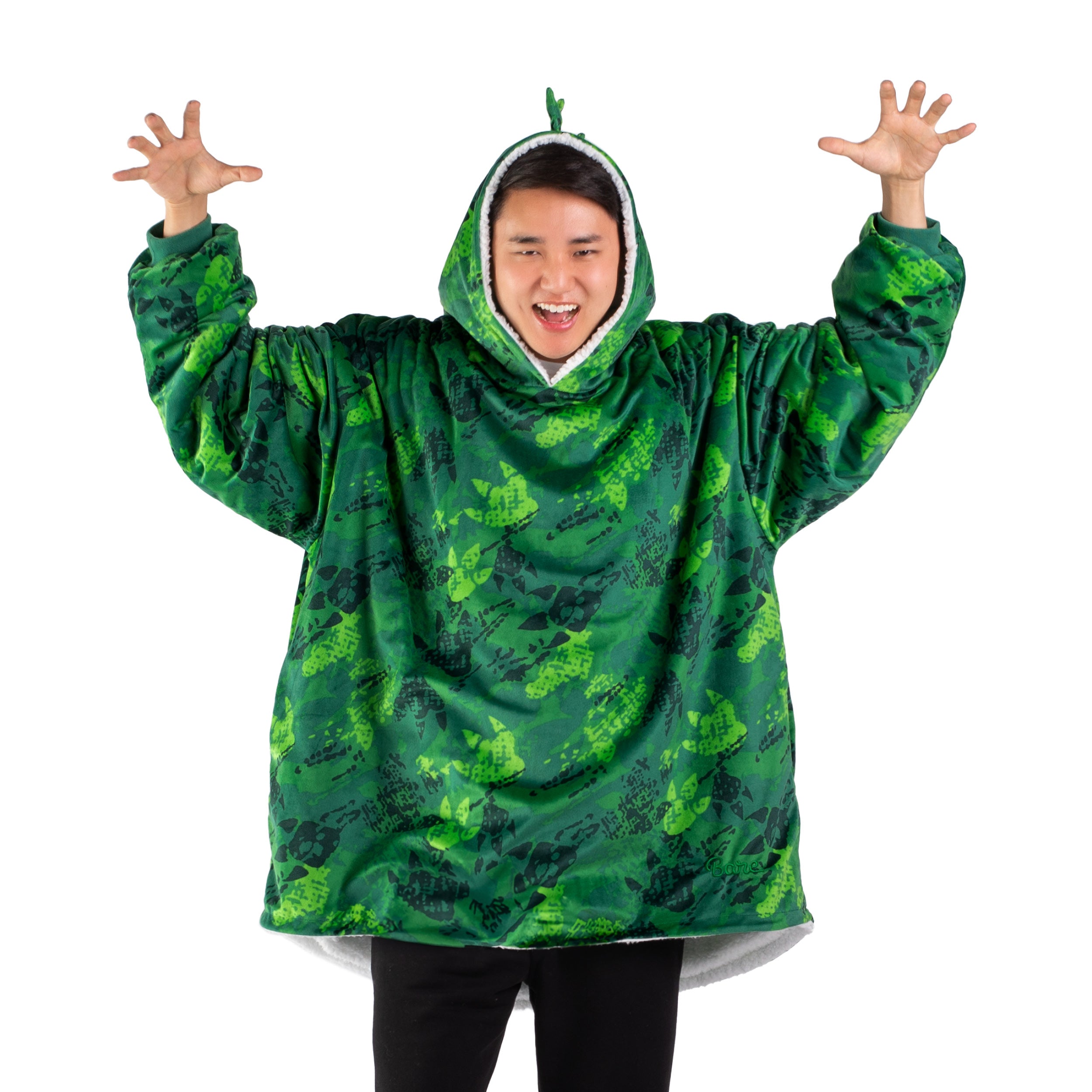 An adult with a hooded wearable blanket on