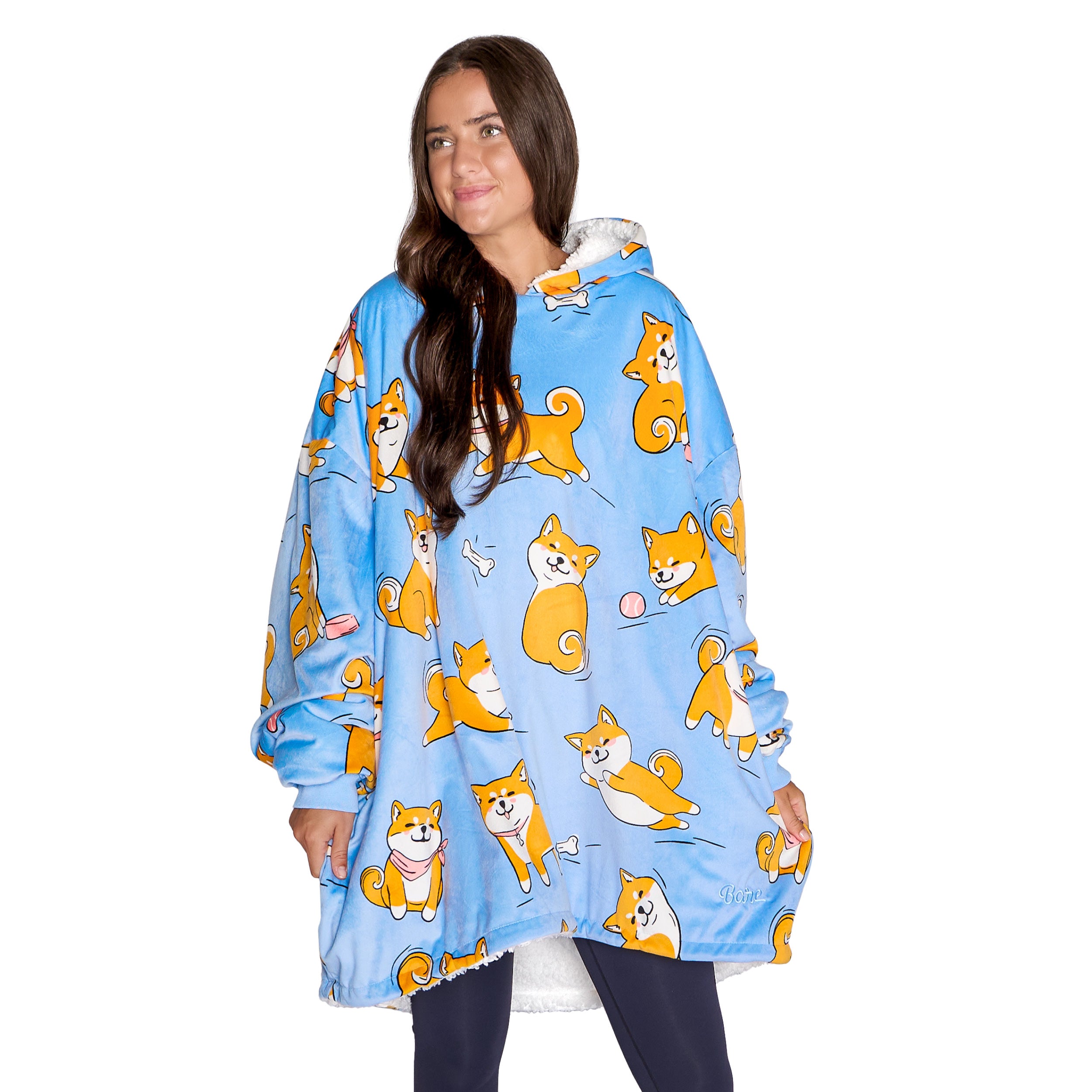 An adult with a sherpa wearable blanket on