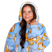An adult with a sherpa wearable blanket on