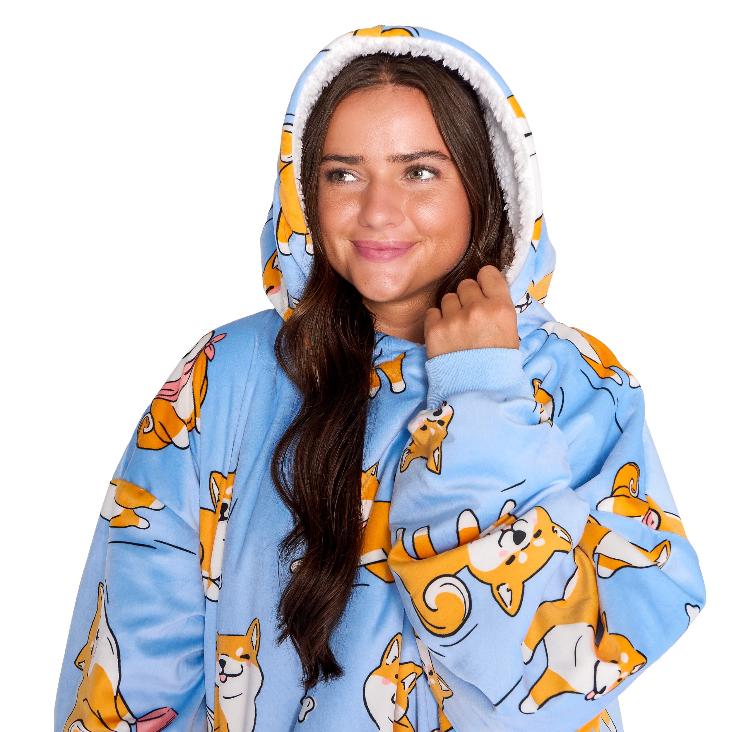 An adult with a sherpa wearable blanket on