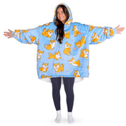 An adult with a hooded wearable blanket on