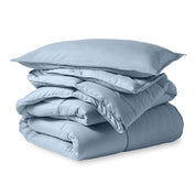 A microfiber comforter folded neatly with a pillow from above