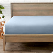 End of bed view with fitted sheet made on the mattress of a modern bed. 