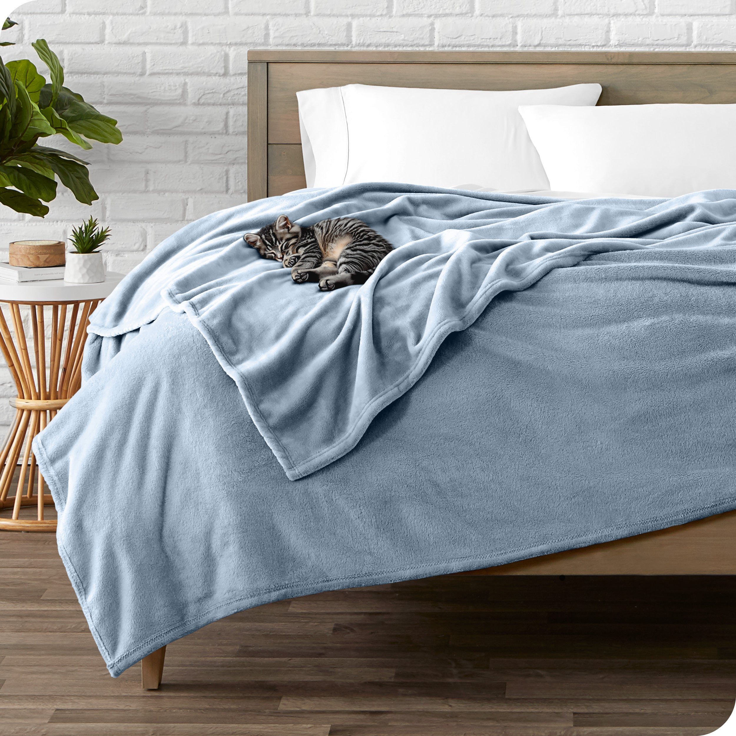 Microplush blanket laid out over a bed and folded back over itself