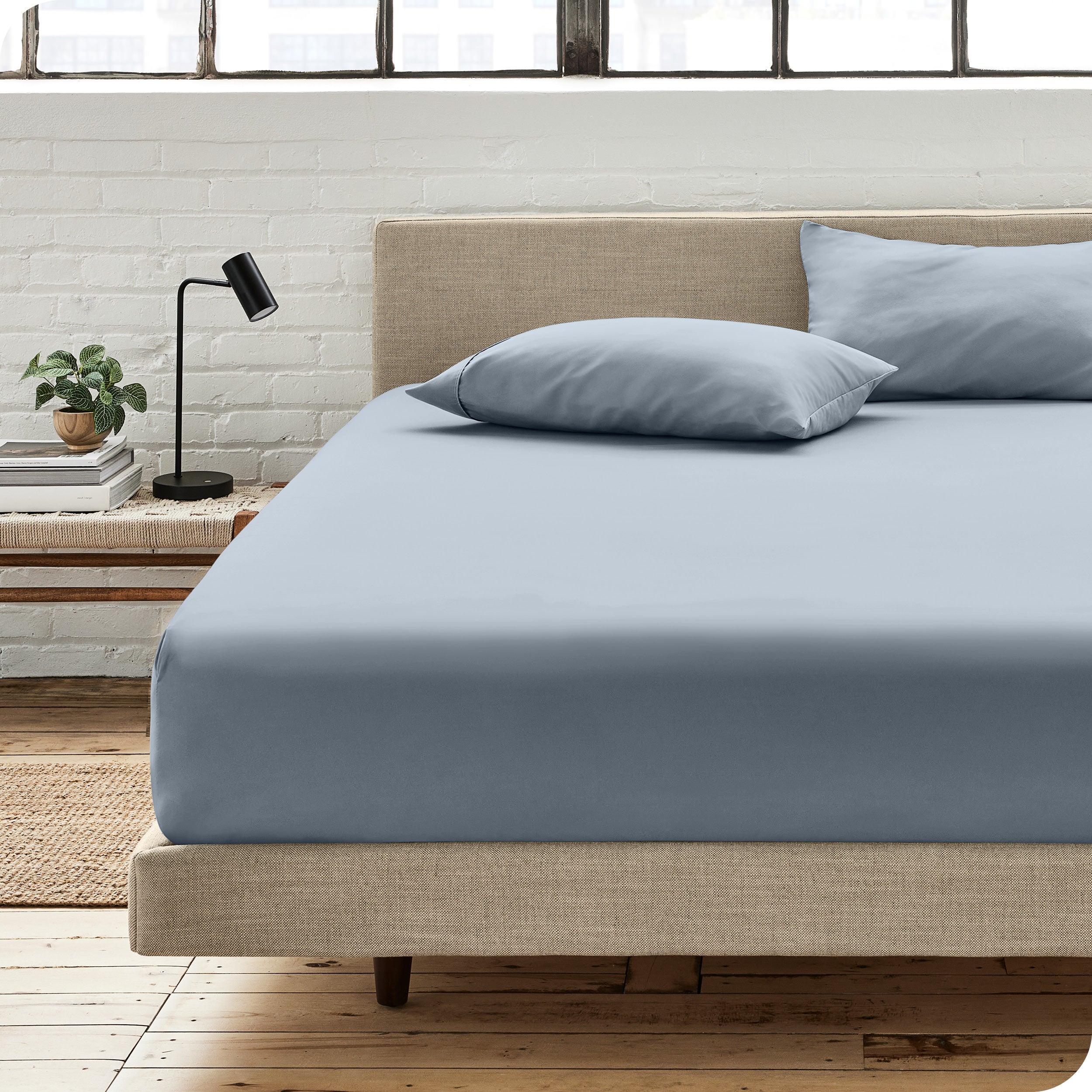 An organic cotton fitted sheet on a mattress