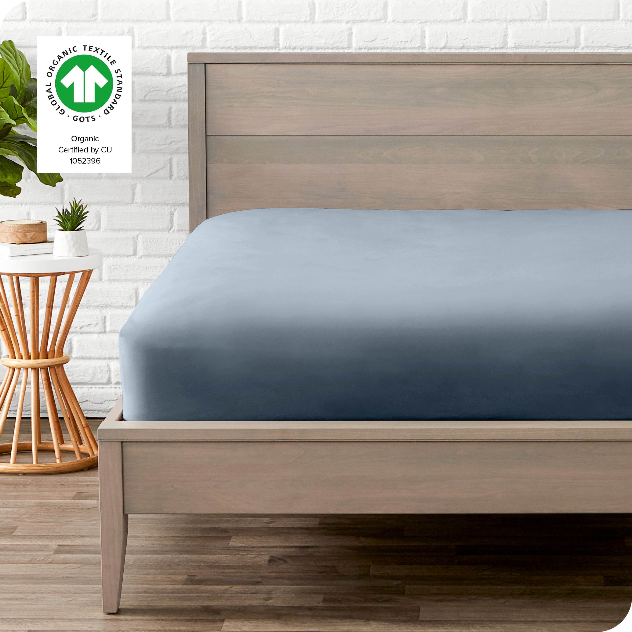 An organic percale bottom sheet on a mattress