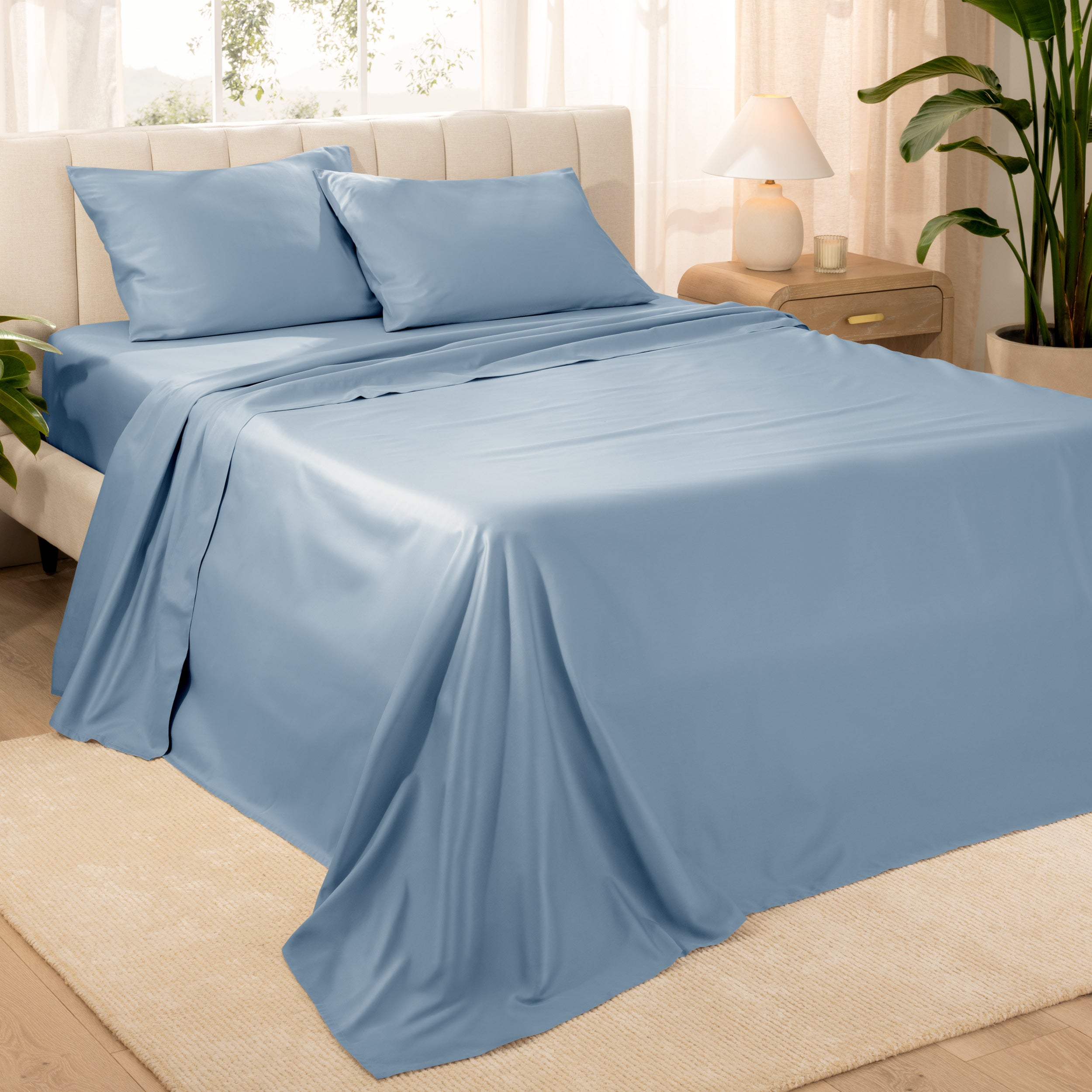 Diagonal view of a decorated room scene with sateen sheets