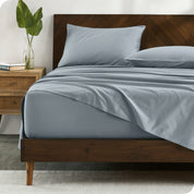 Percale sheets on bed in a modern bedroom