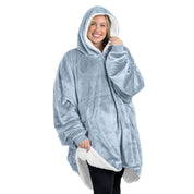 An adult with a sherpa wearable blanket on