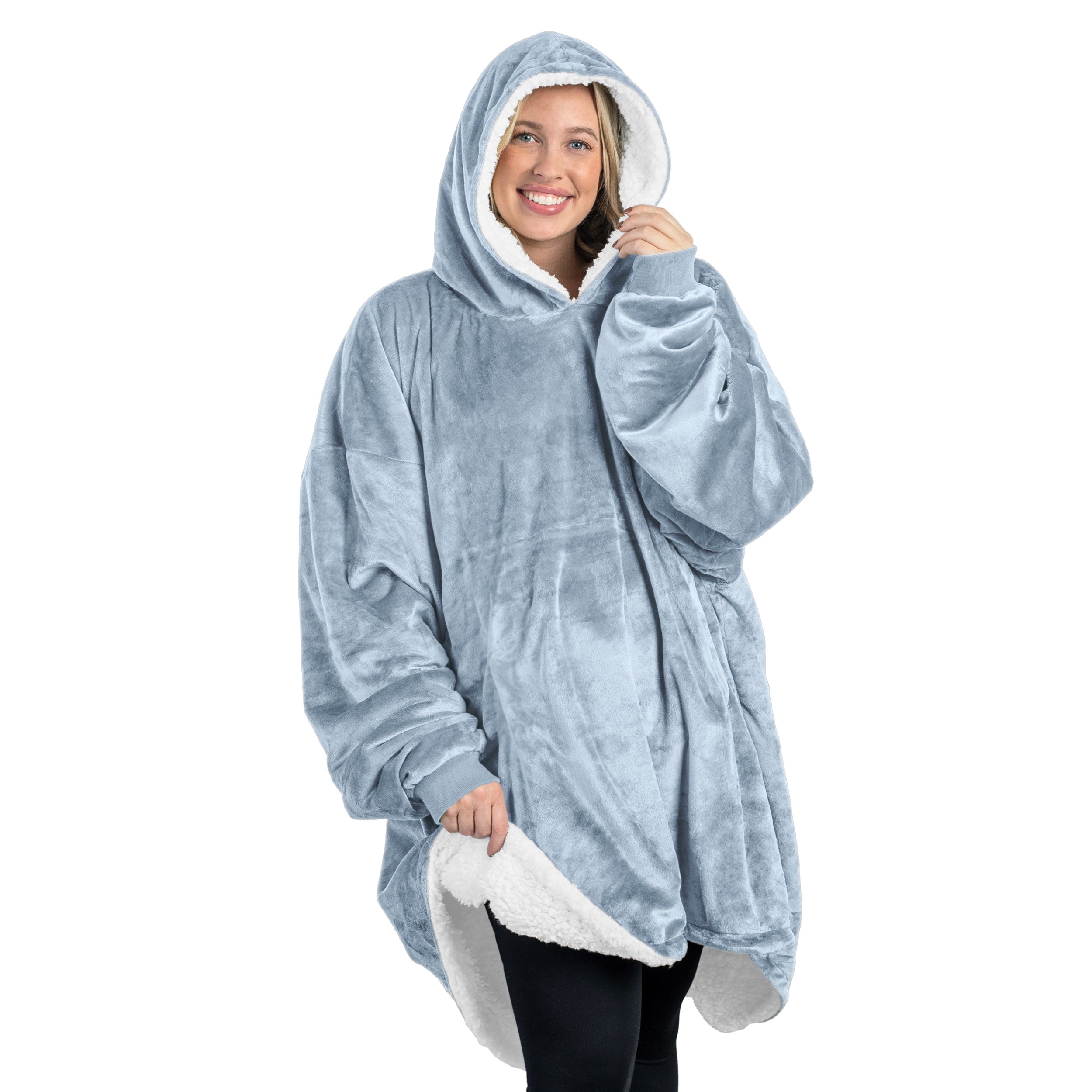 An adult with a sherpa wearable blanket on