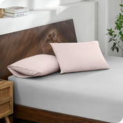 2 pillows with percale pillowcases on a bed
