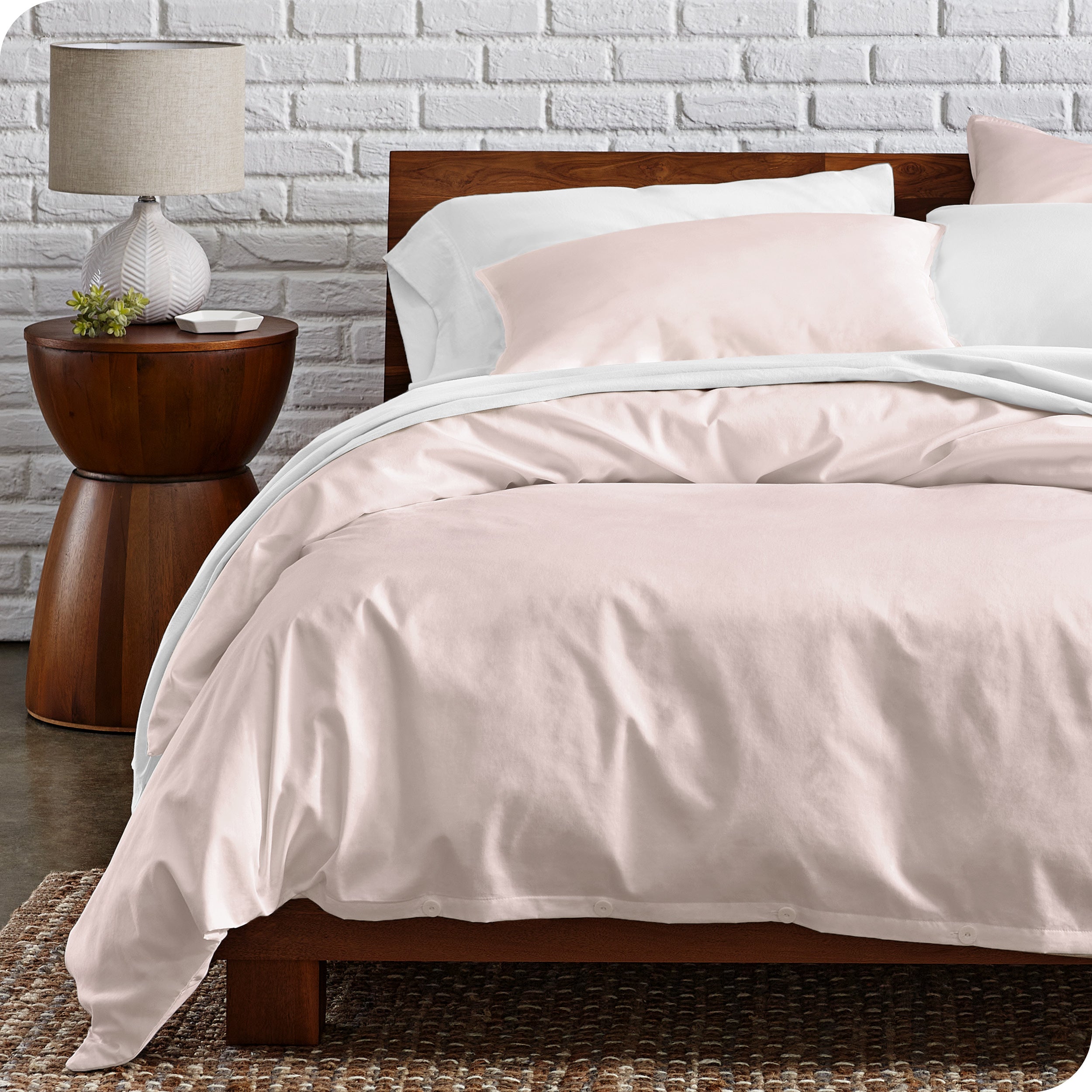 A modern bed with a organic cotton percale duvet cover on.