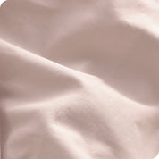 A close view of the organic cotton percale duvet cover showing the texture, color, and fabric.