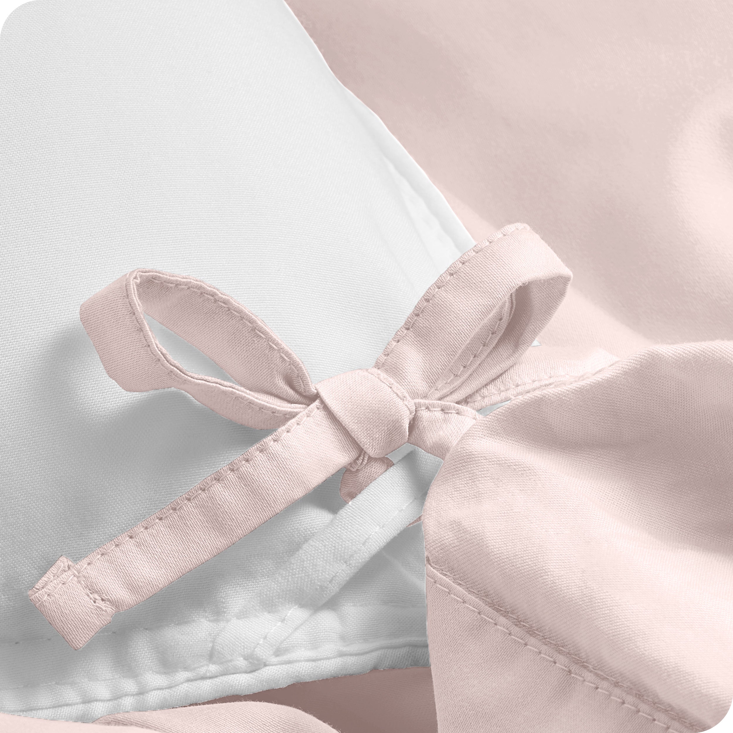 A close view of the corner tie of the duvet cover.