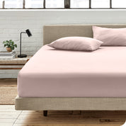An organic cotton fitted sheet on a mattress