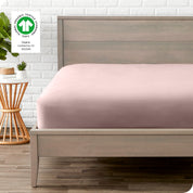 An organic percale bottom sheet on a mattress