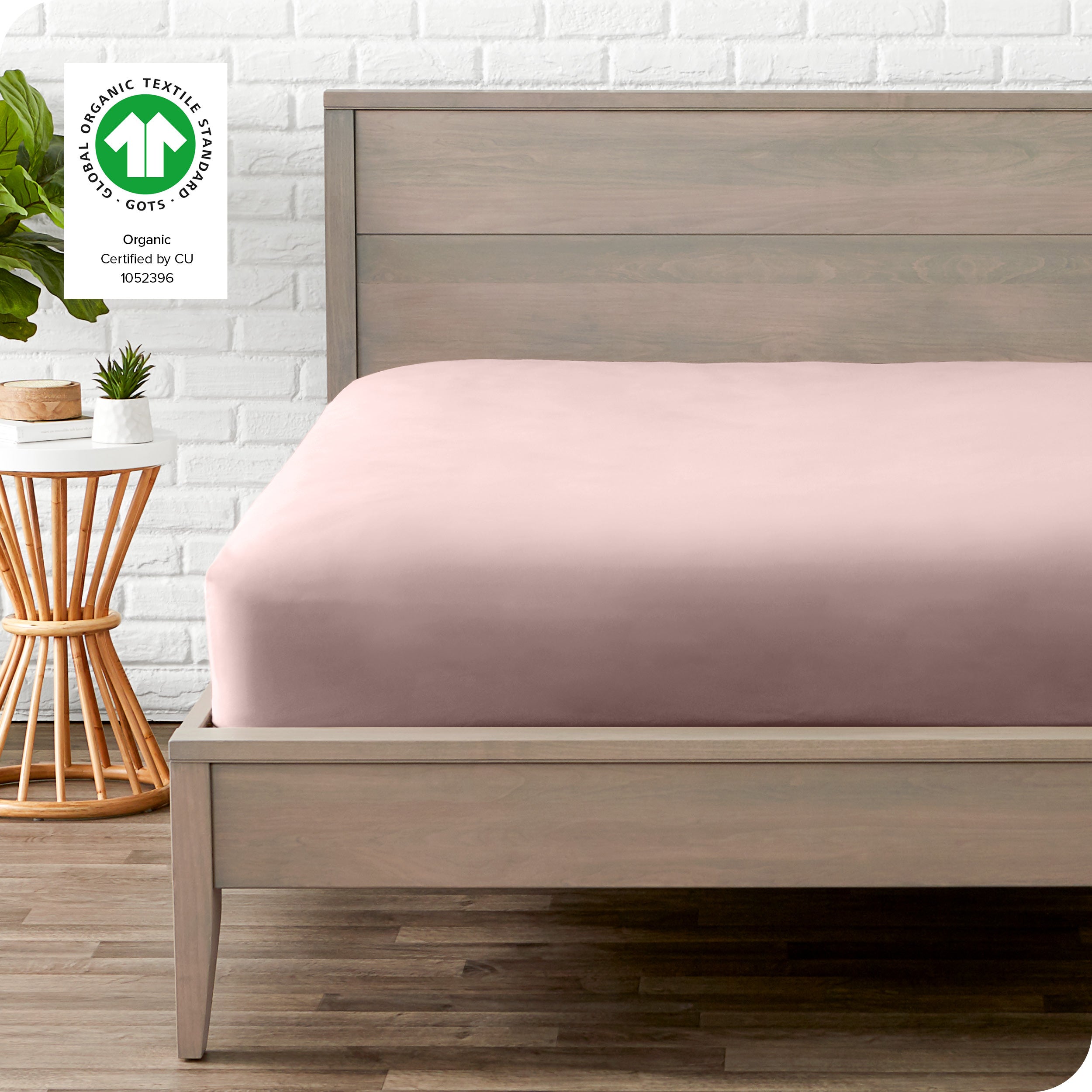 An organic percale bottom sheet on a mattress
