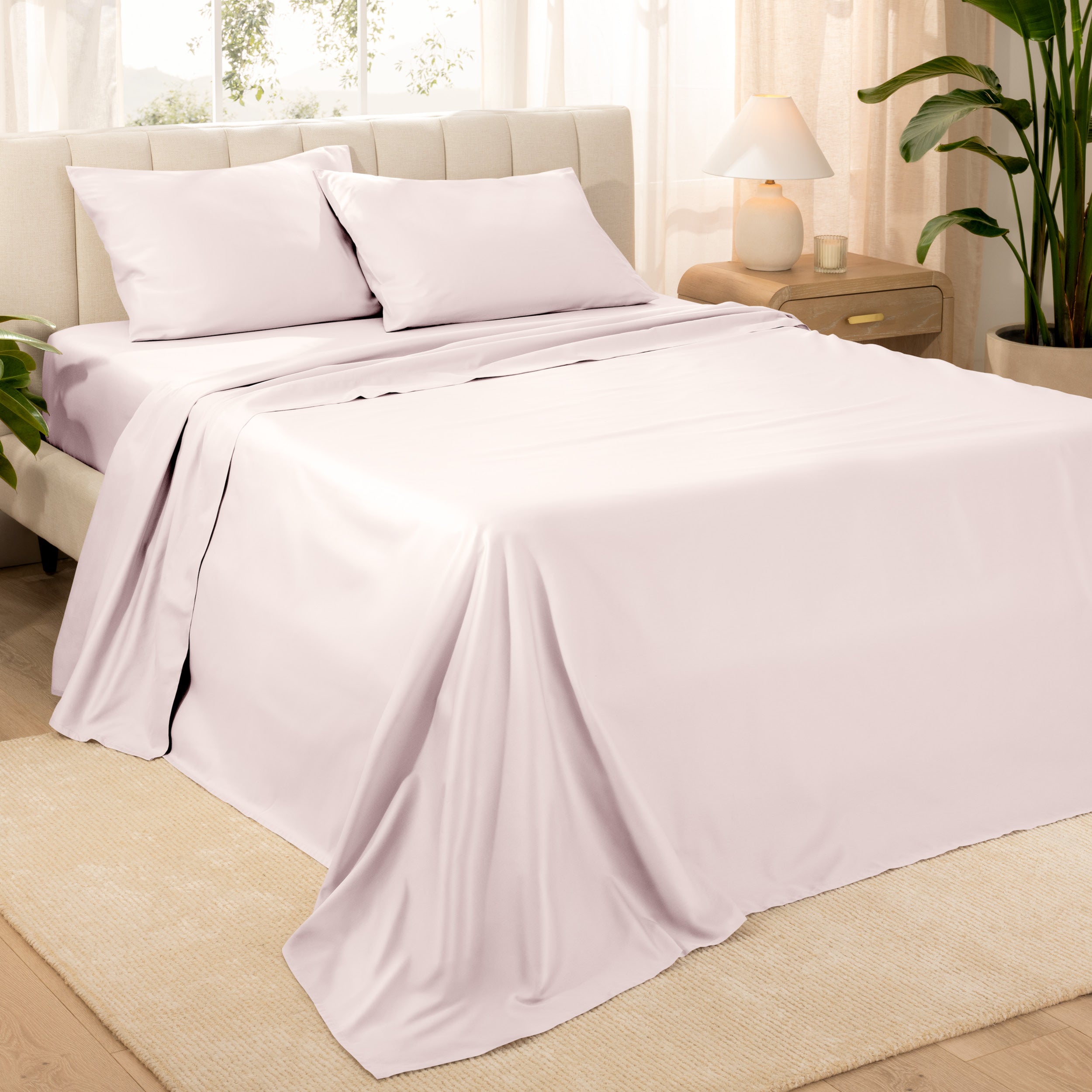 Diagonal view of a decorated room scene with sateen sheets