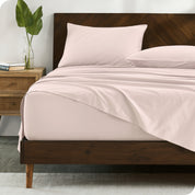 Percale sheets on bed in a modern bedroom