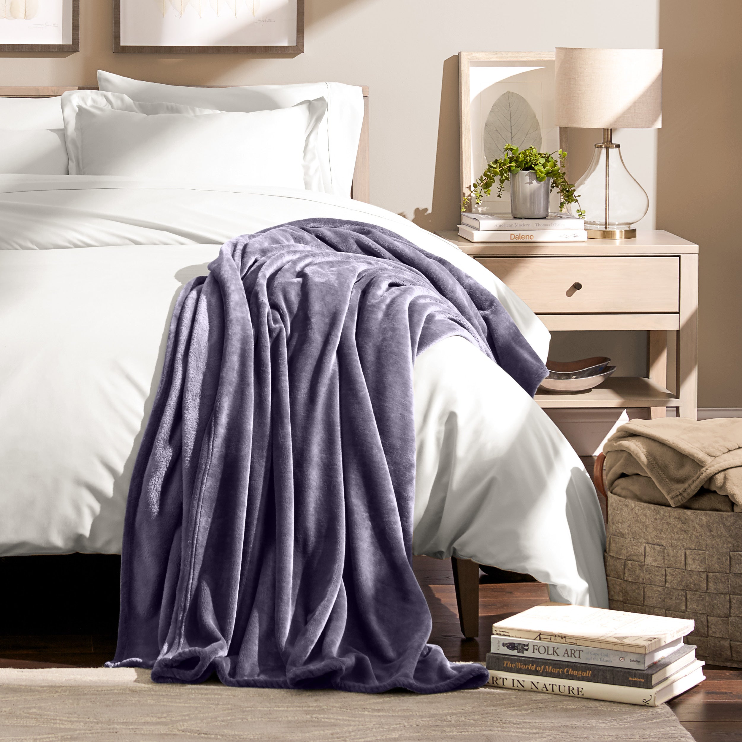 Microplush blanket laid out over a bed and folded back over itself