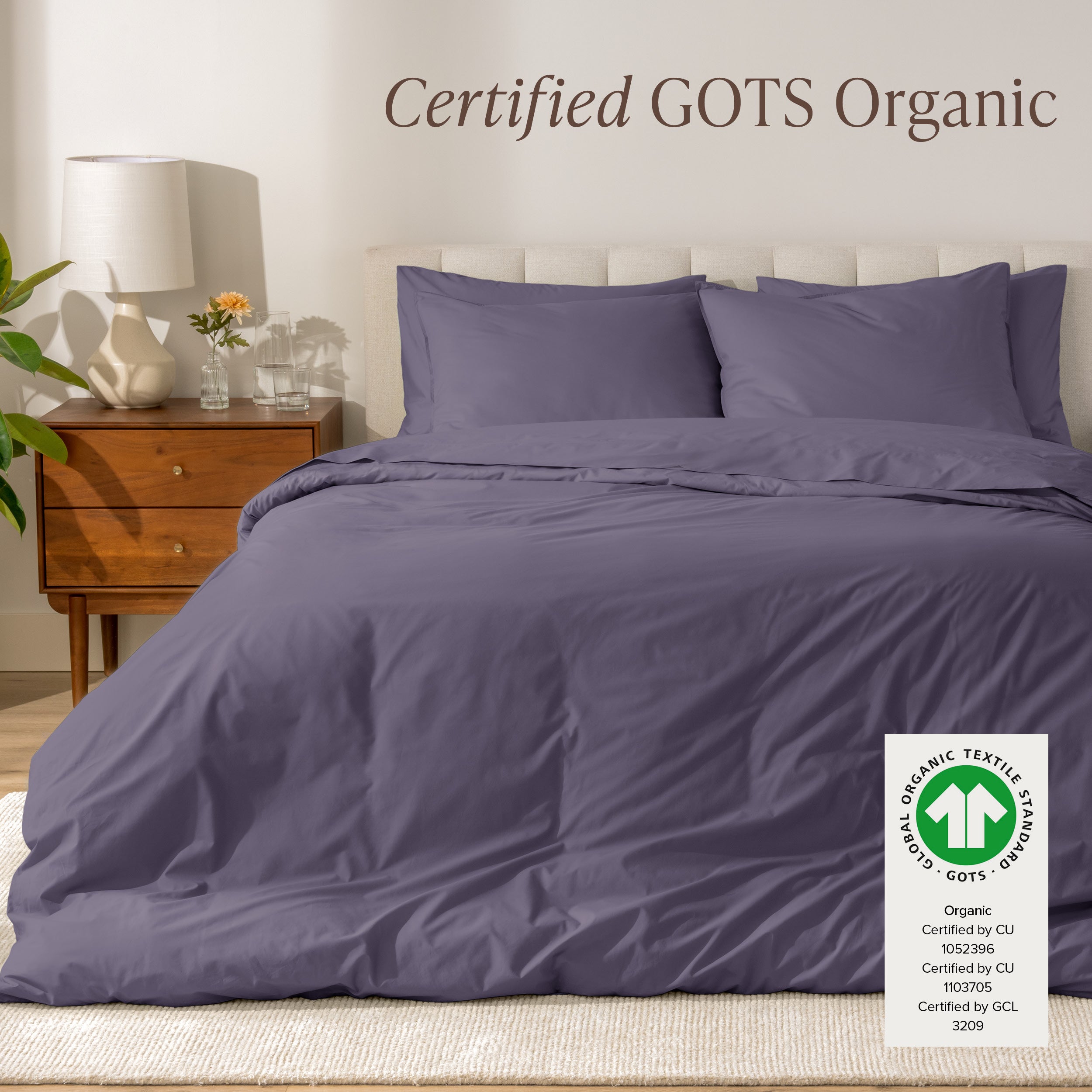 A modern bed with a organic cotton percale duvet cover on, it's Certified GOTS Organic.