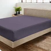 A sateen fitted sheet on a bed